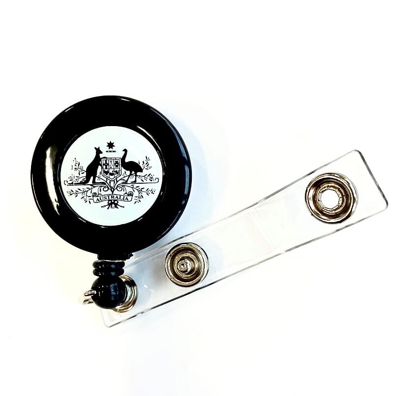 Aust. Coat of Arms Reel with Belt Clip & Strap Clip (86cm nylon cord with strap & an epoxy dome with the Australian Coat of Arms logo printed & "100% RECYCLED PLASTIC MATERIAL" on the back.